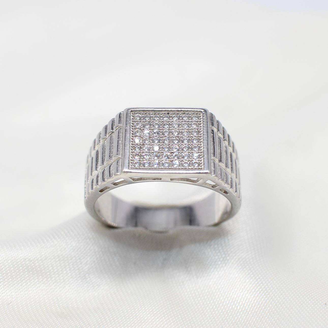 SILVER PAVE-SET DINNER RING.