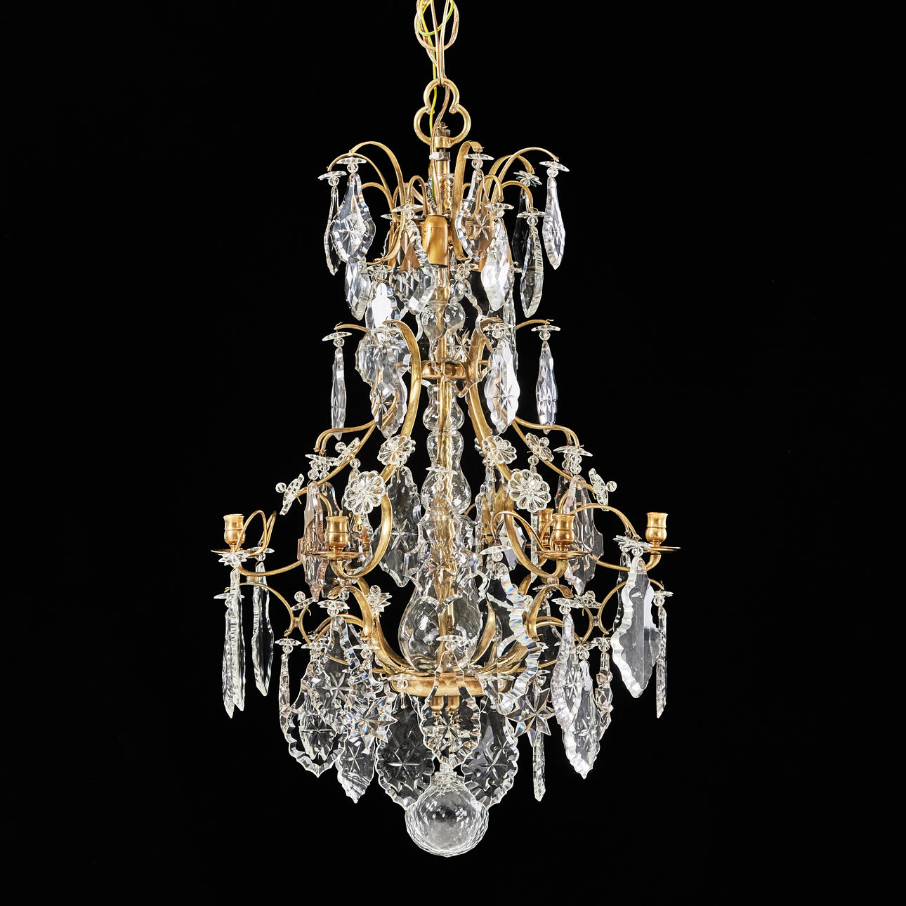 A rococo style chandelier, early 20th century, for six candles, brass ...