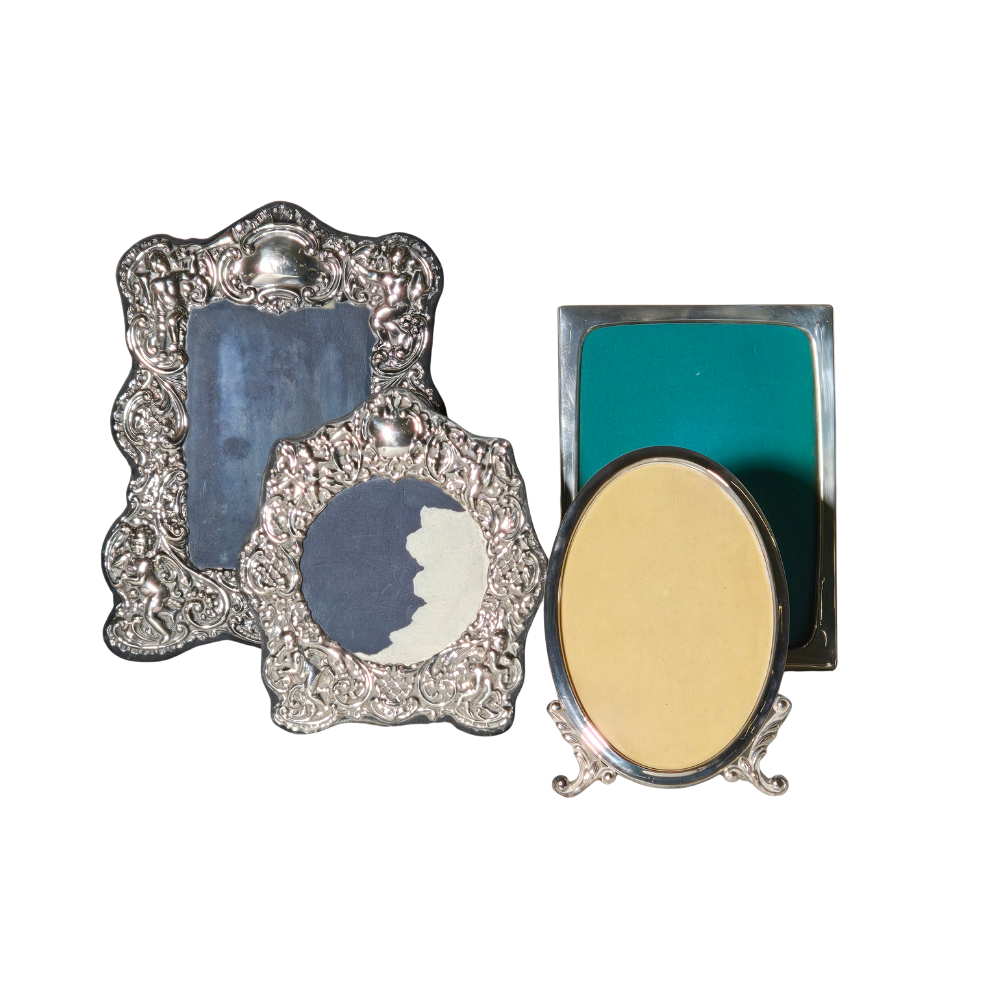 FOUR FRAMES IN PUNCHED AND EMBOSSED SILVER.