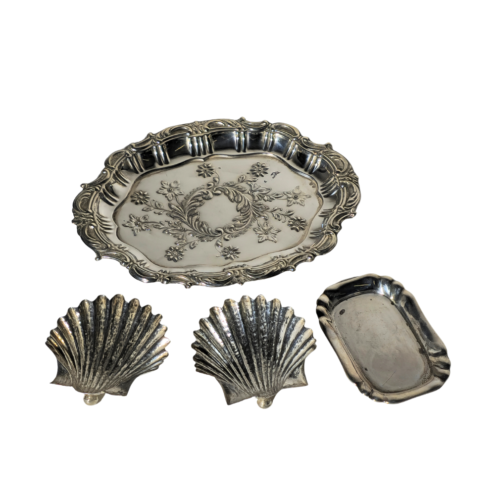 FOUR PUNCHED SILVER TRAYS.