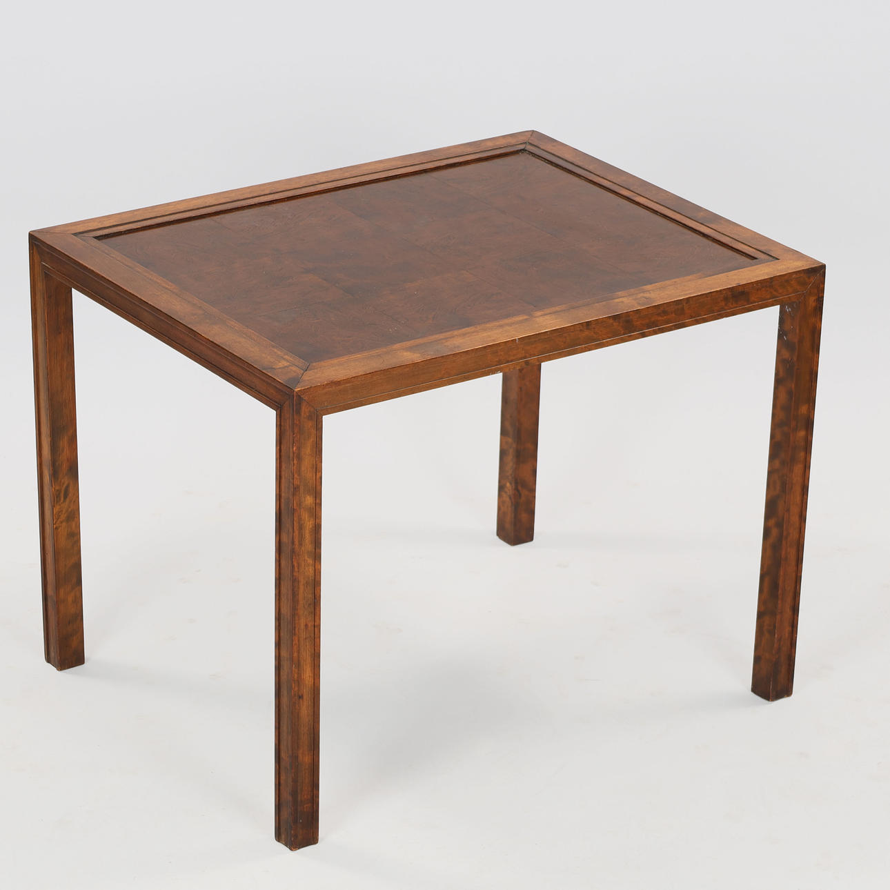 Rectangular lacquered nut coffee table with profiled edges, circa 1920s.