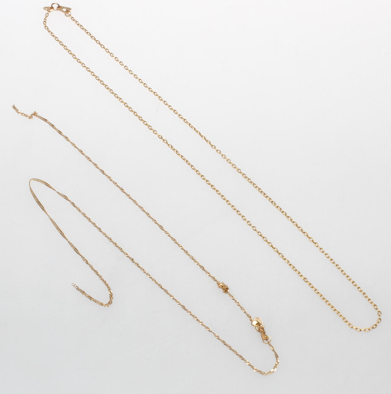 HALSKEDJOR, 2 st, 18-21k guld, vikt ca 7,4 gr.