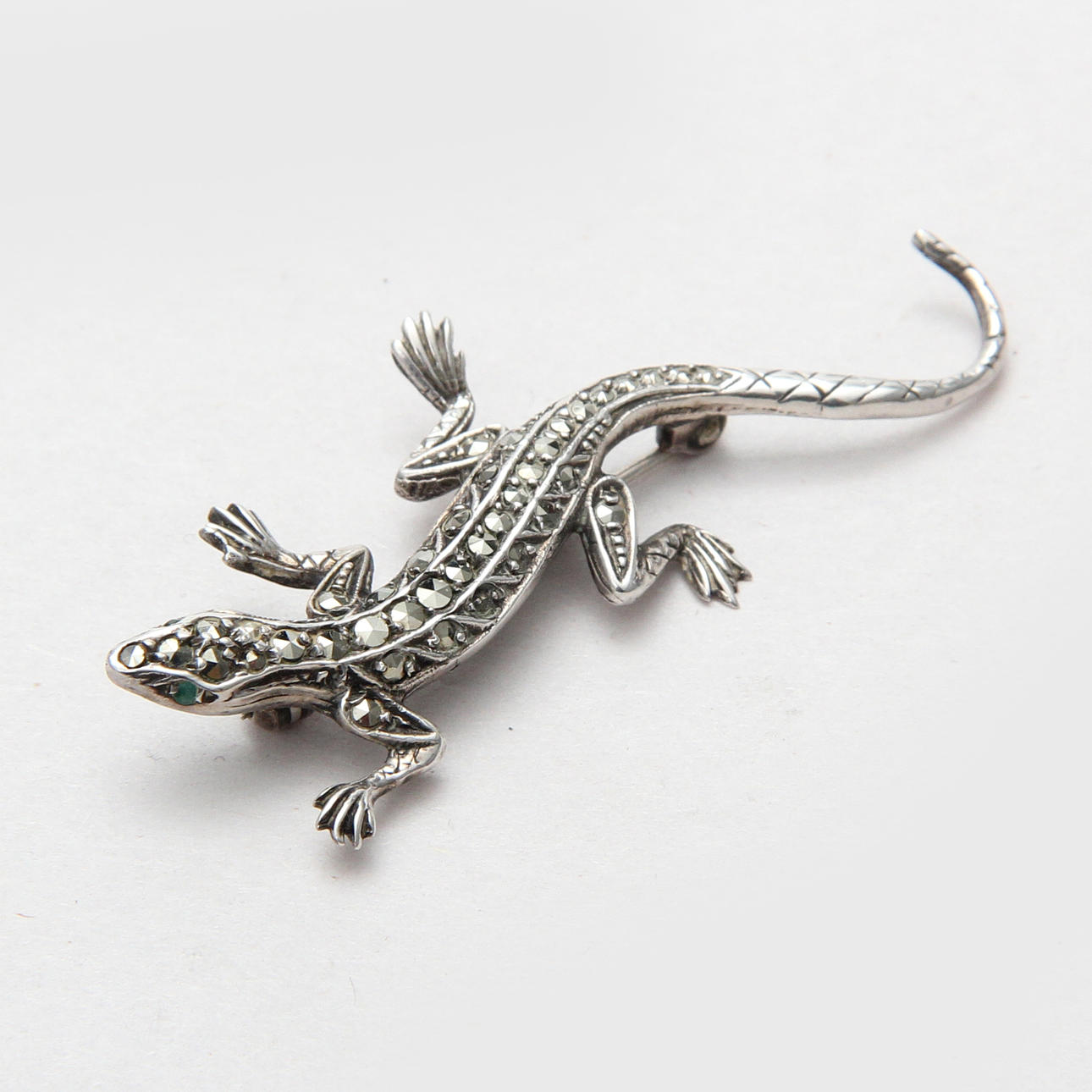 A BROOCH, silver.