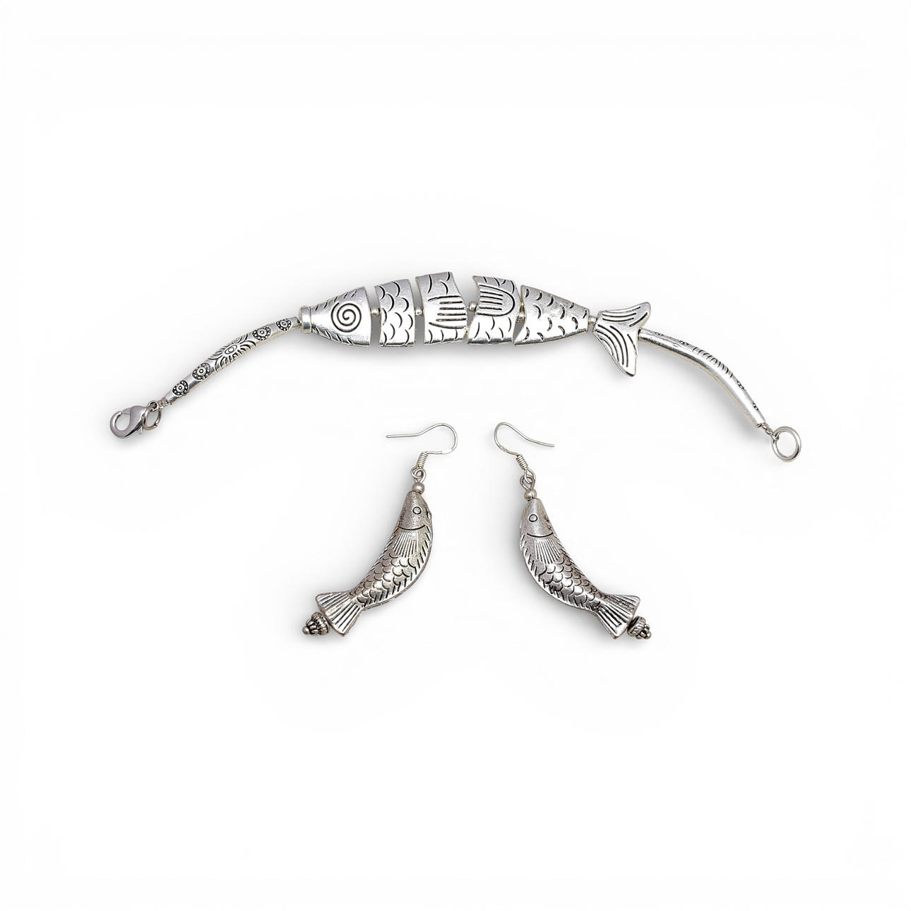 Long earrings and fish-shaped bracelet.