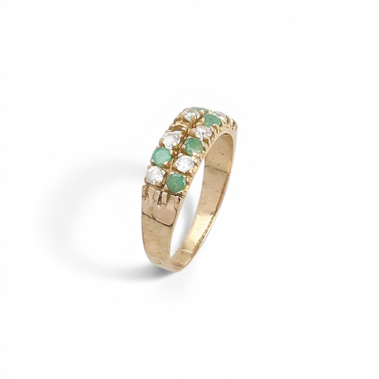 Gold, emeralds and zircons ring.