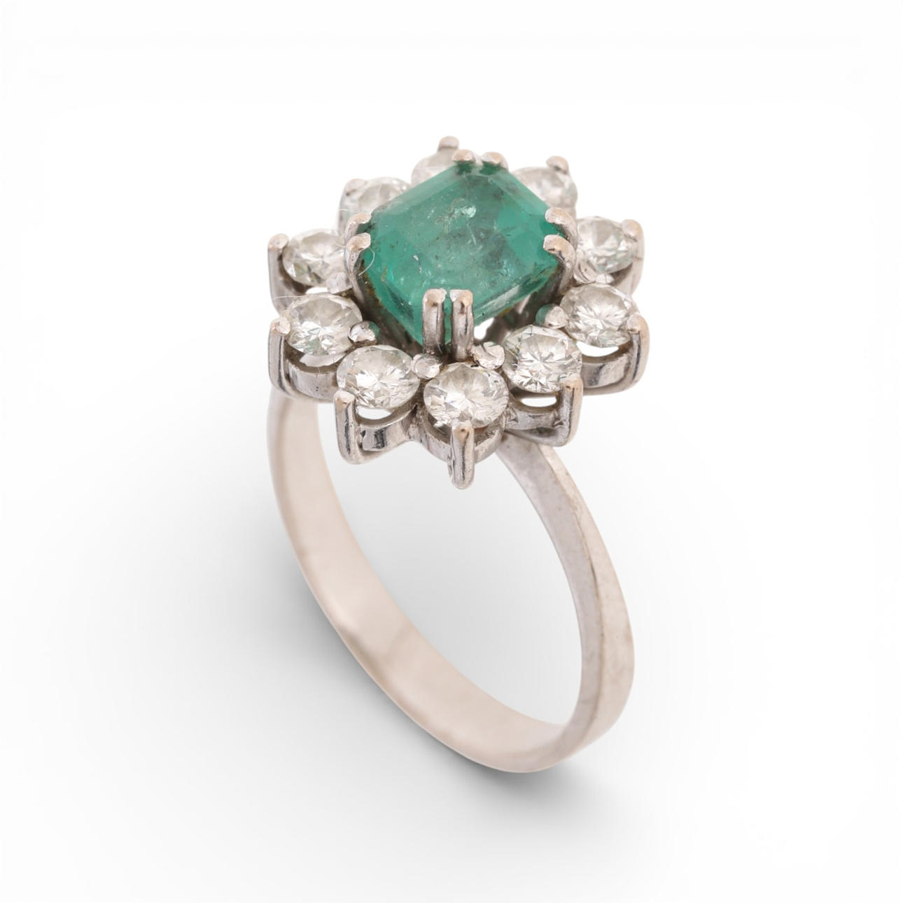 Emerald and diamonds rosette ring.