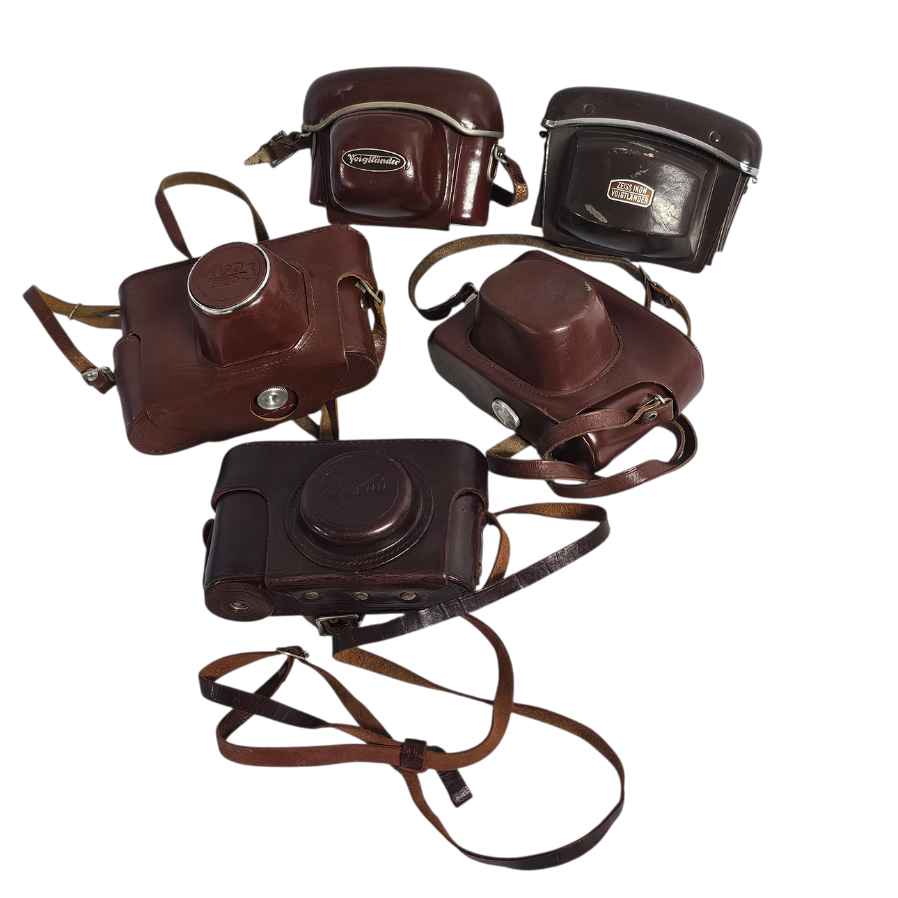 Set of five leather camera covers.