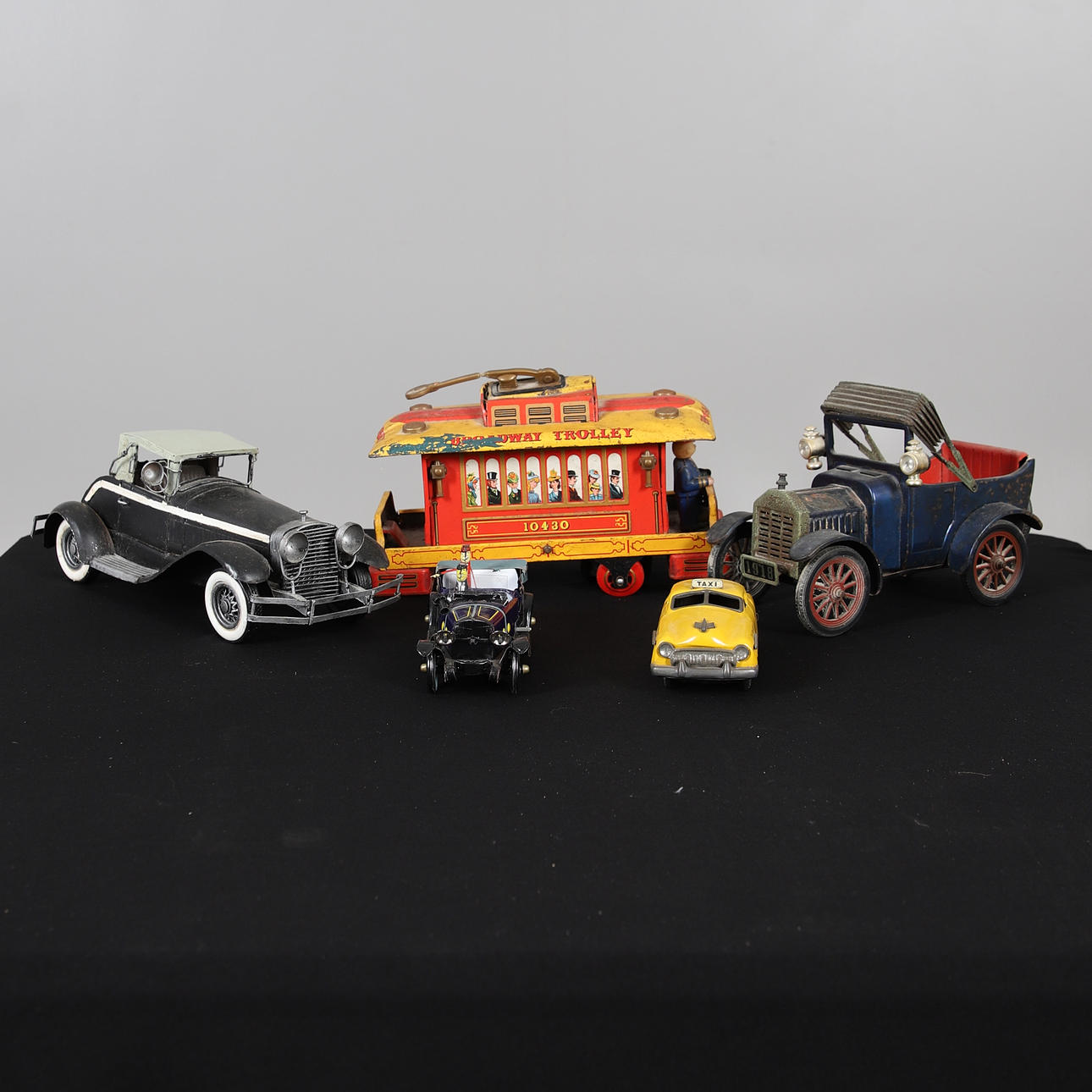 A SMALL QUANTITY OF SMALL MODEL CARS.
