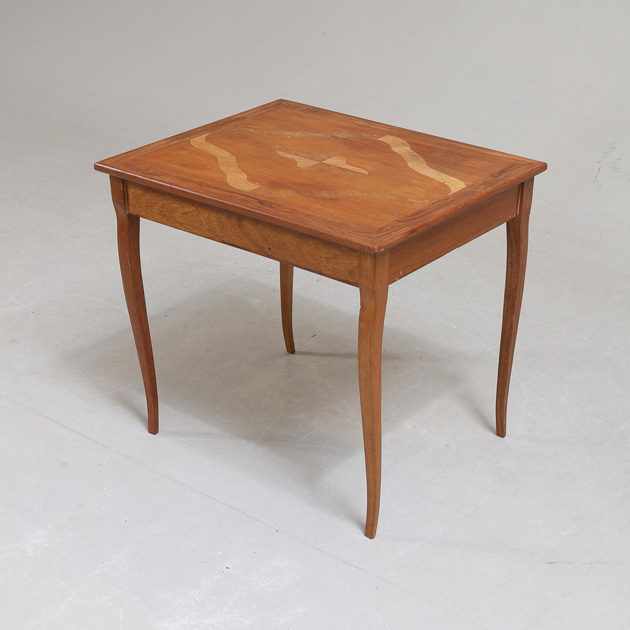 A 20th century oak sewing table with intarsia.