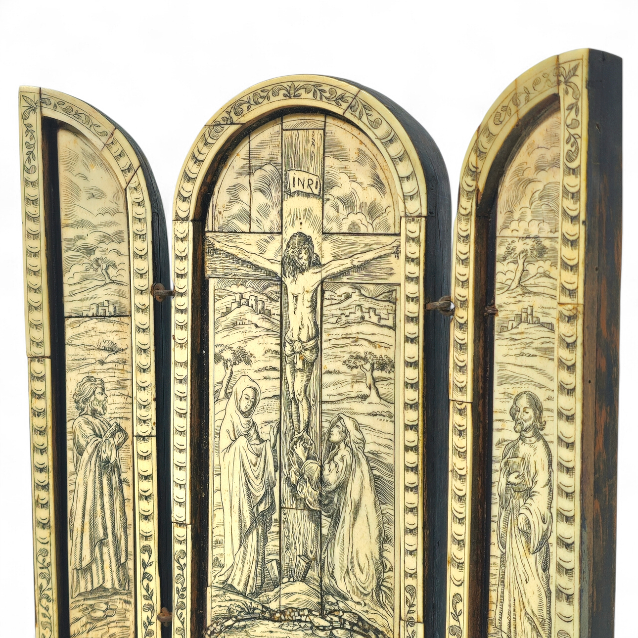 Religious triptych with the image of Christ on the Cross in chiseled ...