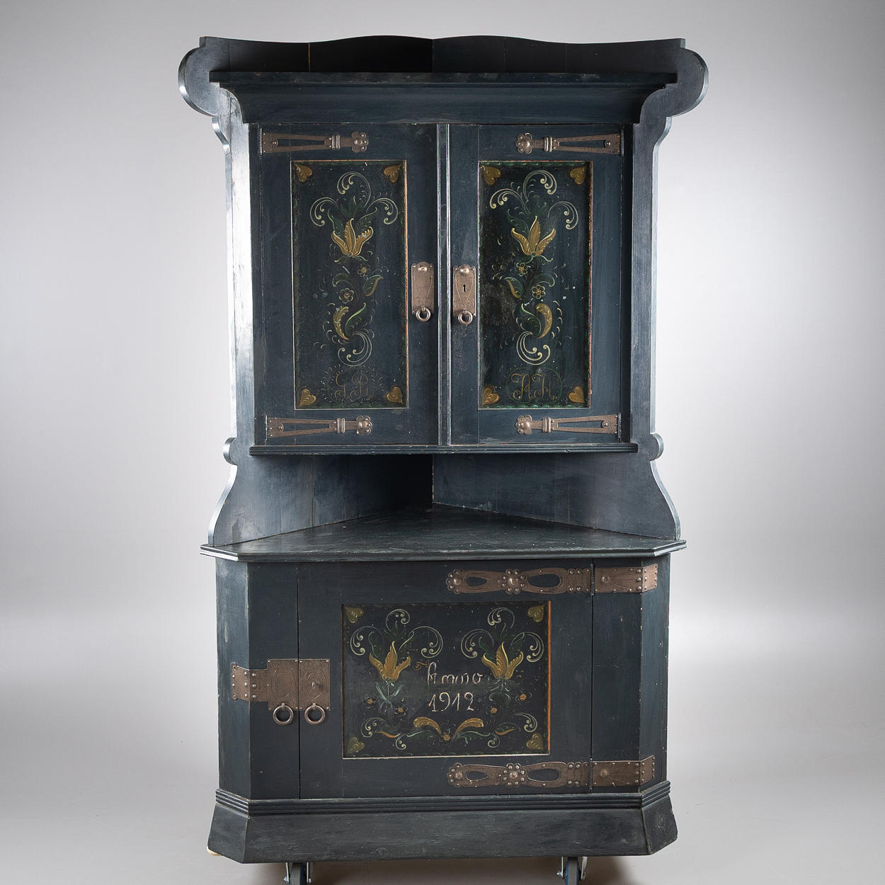 A corner cabinet, Art Nouveau, painted pine, dated 1912.