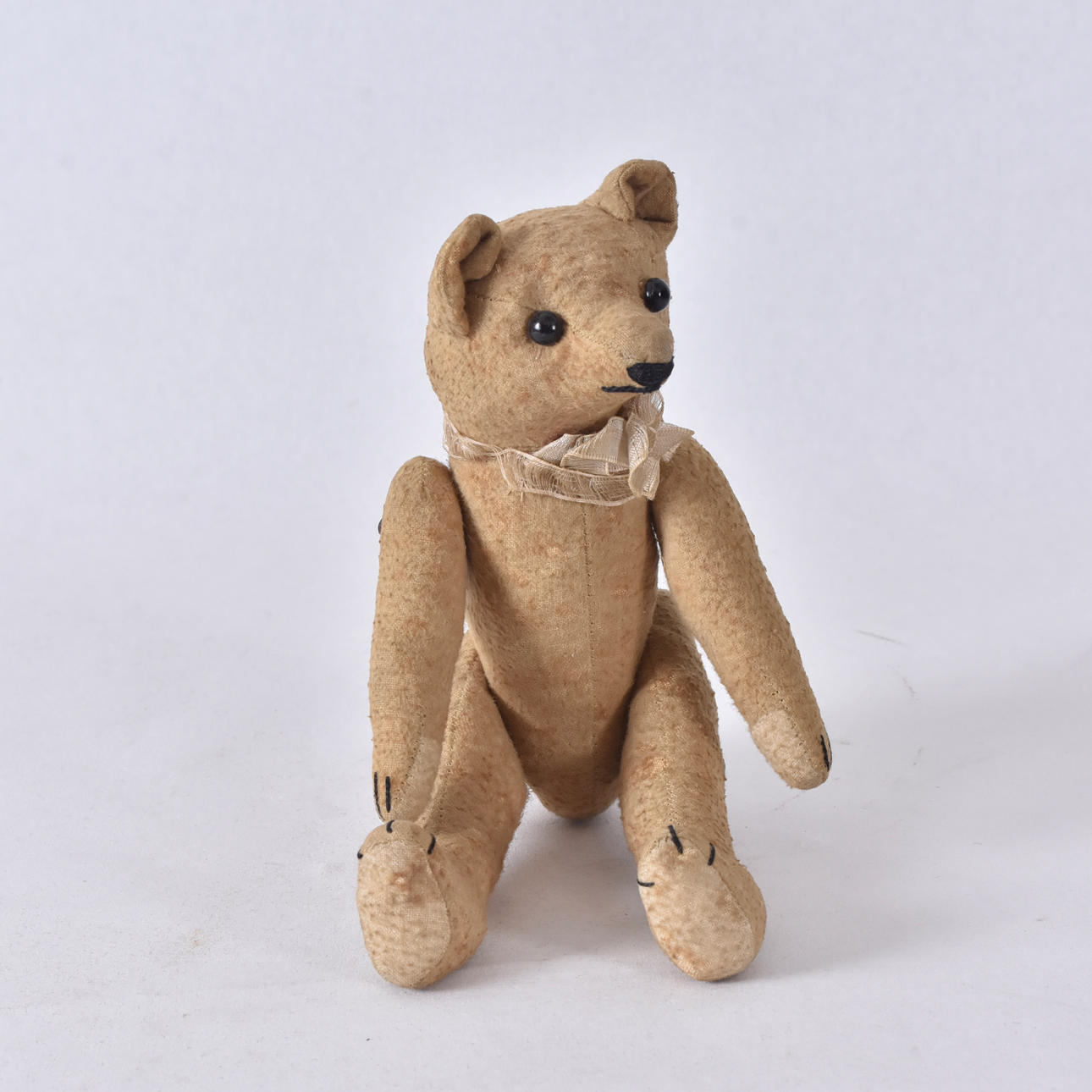 A plush teddy bear, early 20th century.