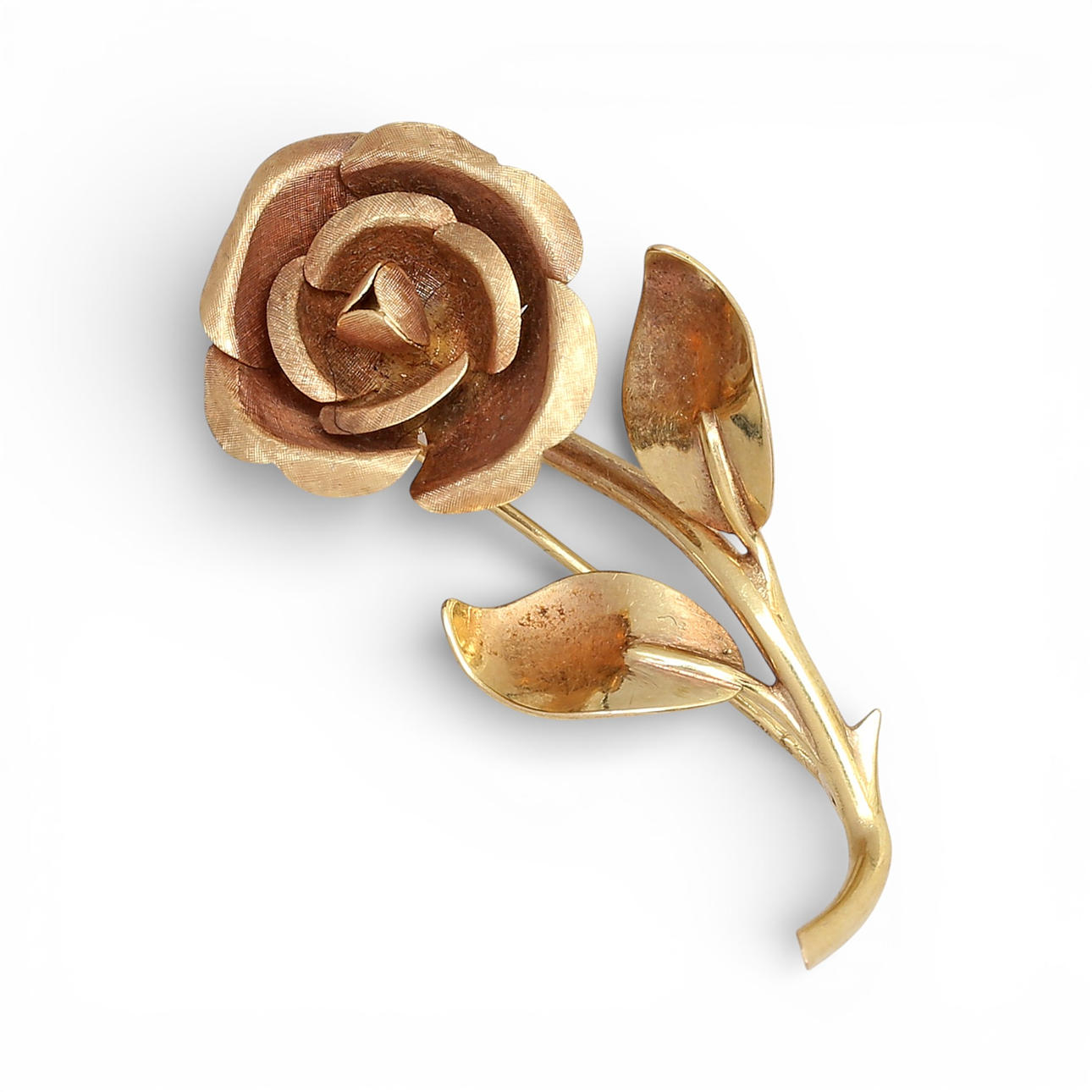 Rose-shaped gold brooch.