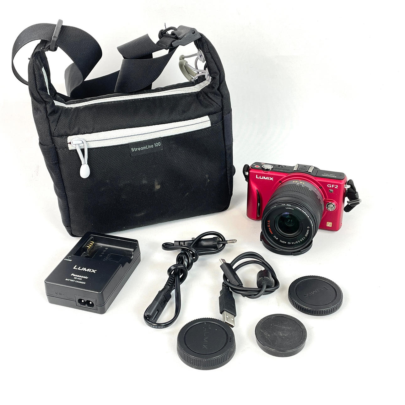 SYSTEM CAMERA. Panasonic Lumix DMC-GF2, with lens and accessories.