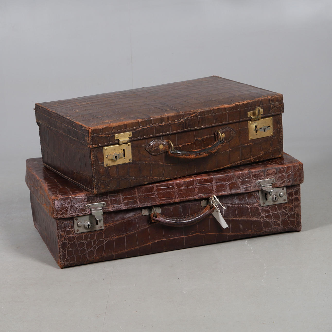 ANTIQUE CROCODILE SKIN SUITCASES.