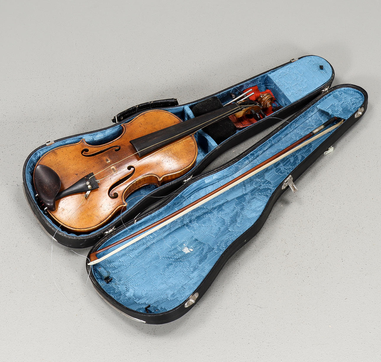 Violin with string in box.
