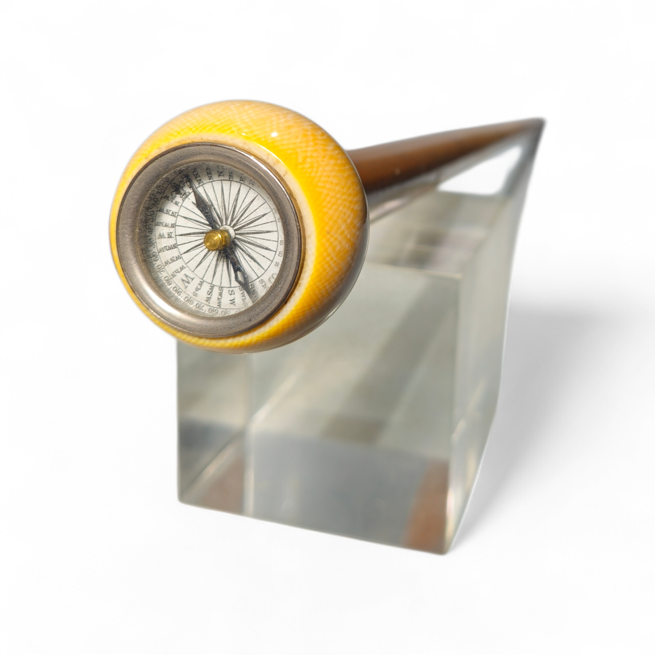 Cane with a compass grip in a bone ball.