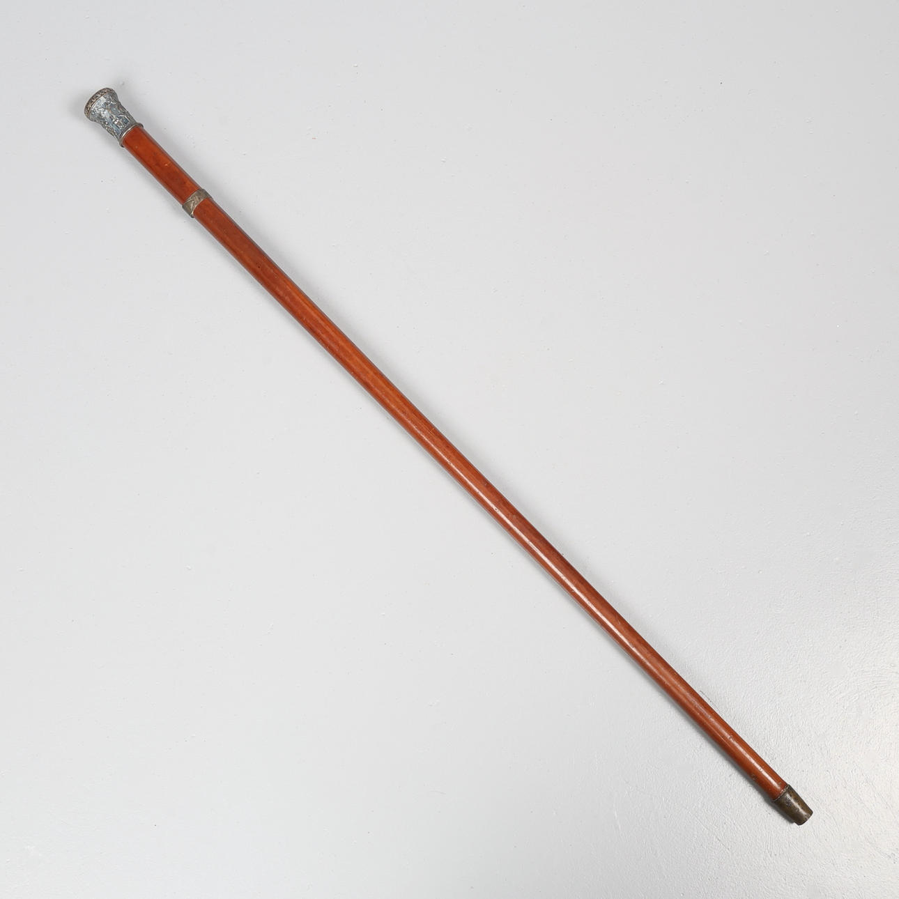 INDIAN WHITE METAL MOUNTED MALACCA CANE.