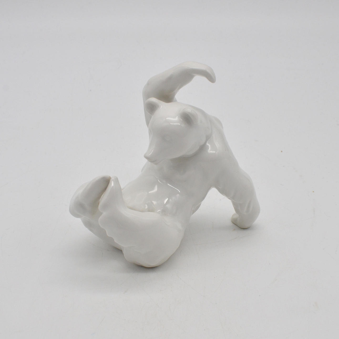 KPM PORCELAIN FIGURE, PLAYING BEAR, CONTEMPORARY, WHITE.