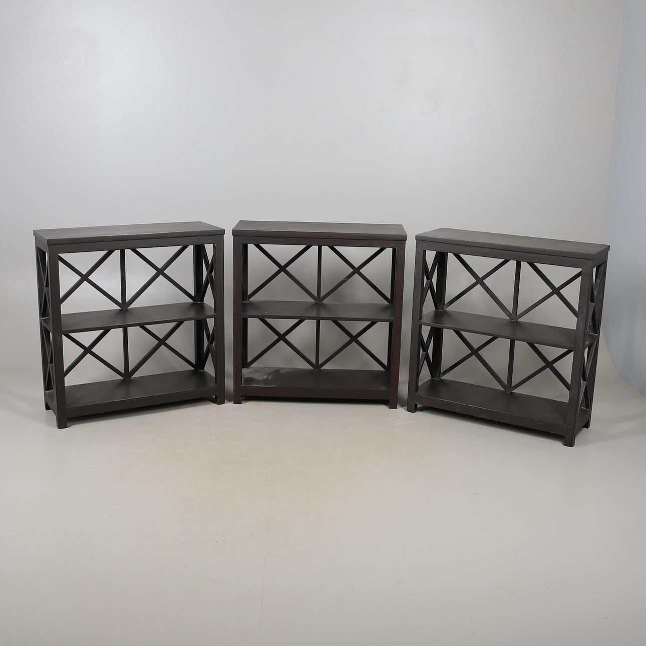 SET OF THREE OKA BOOKCASES.