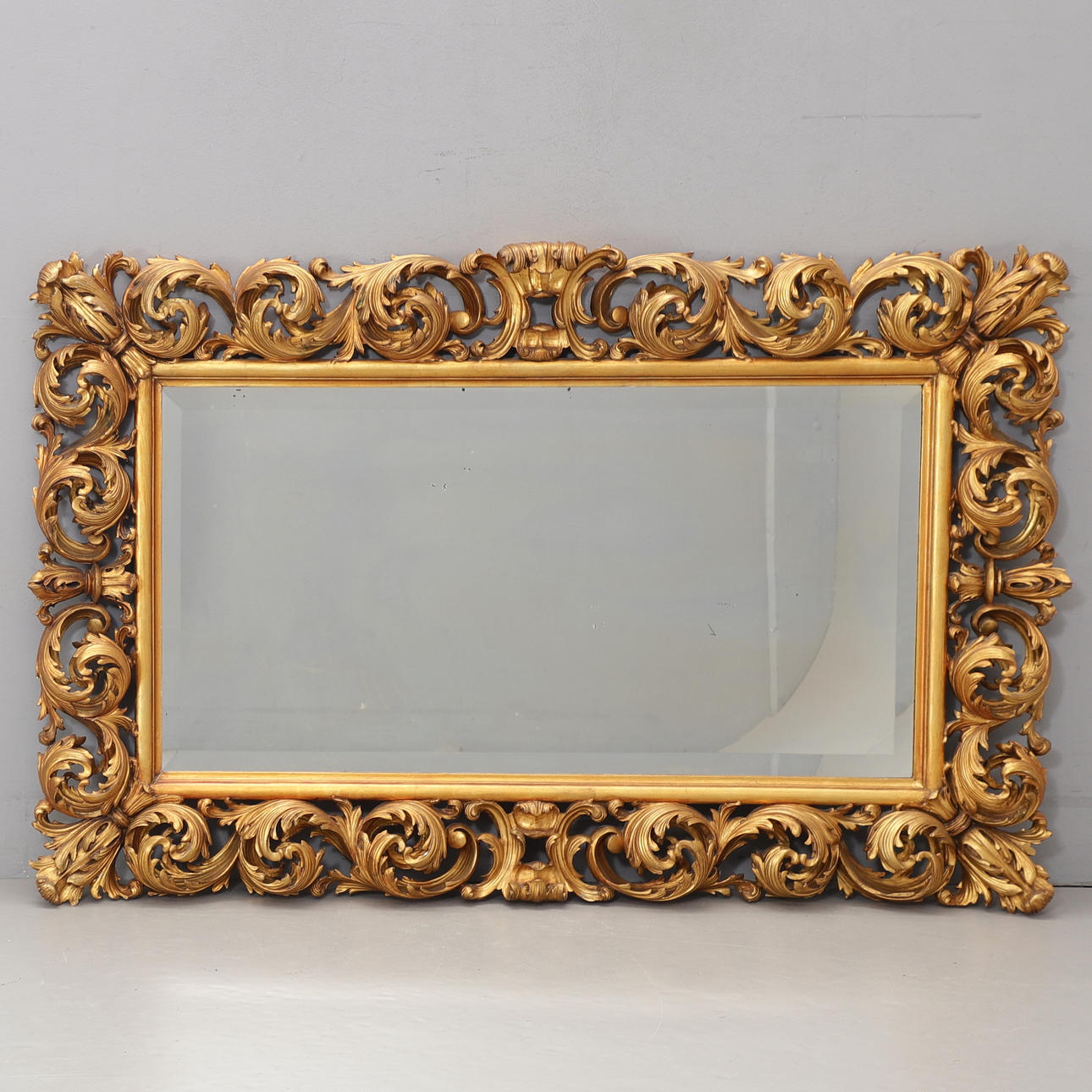 A 20th century rococo style mirror.