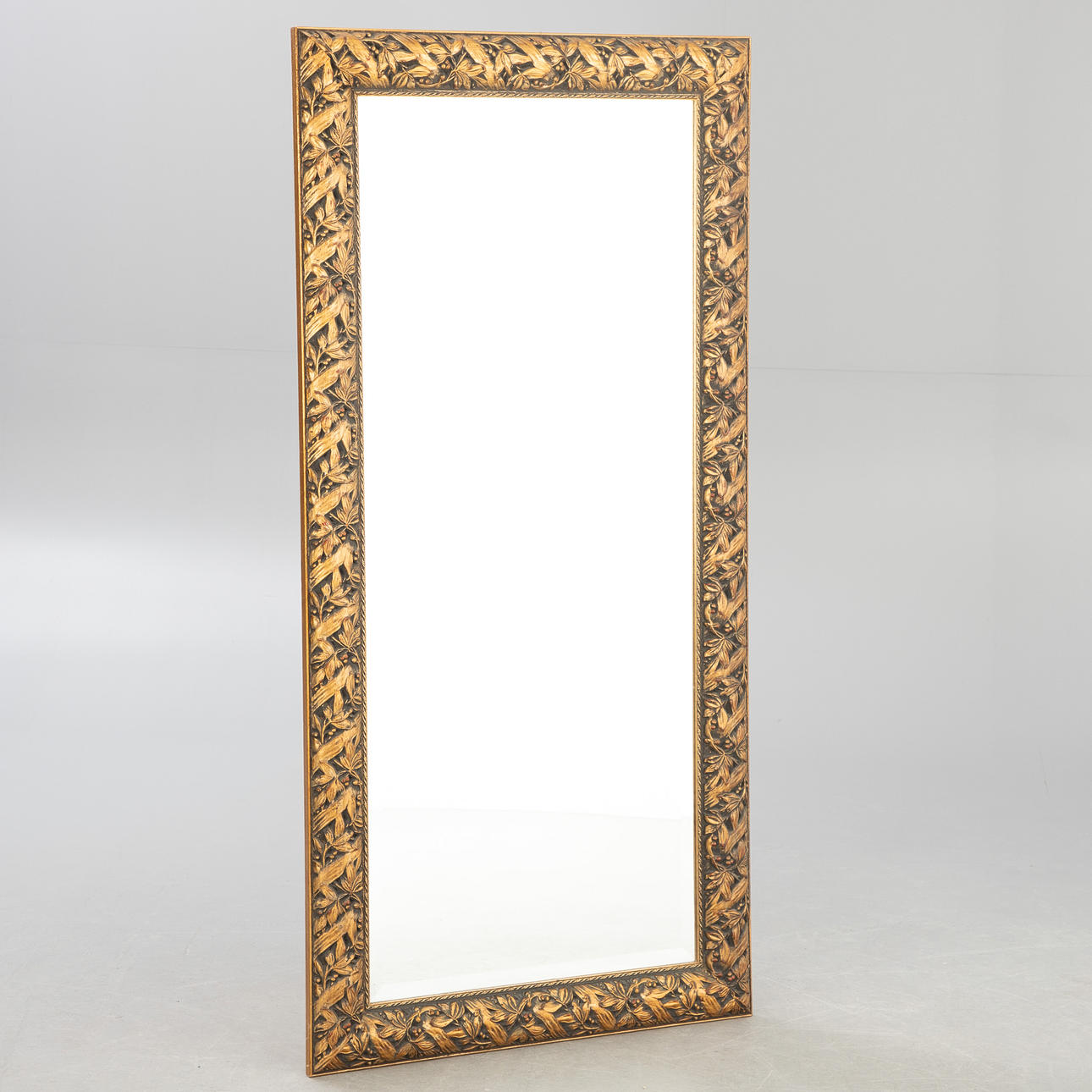 High rectangular mirror with laurel leaf relief.