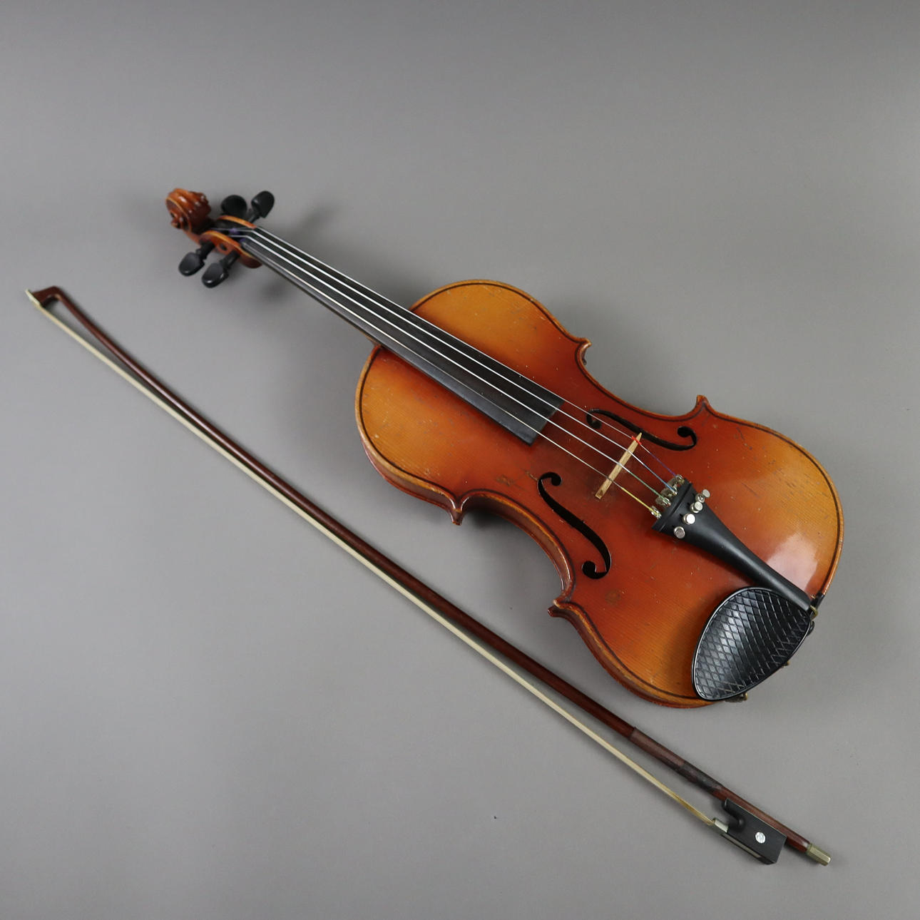 - VIOLIN WITH BOW IN A VIOLIN CASE.
