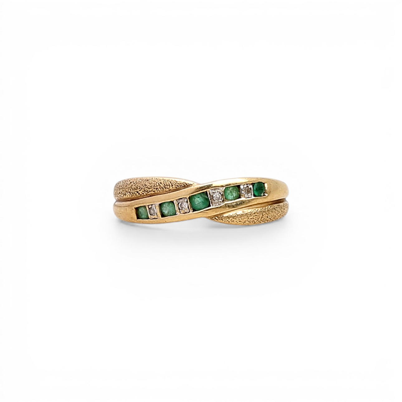 Emeralds and diamonds ring.