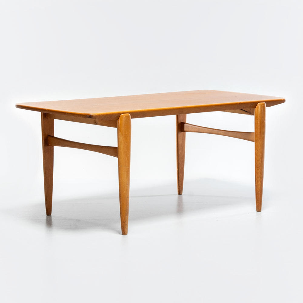 A mid 20th century oak-teak/mixed wood table.