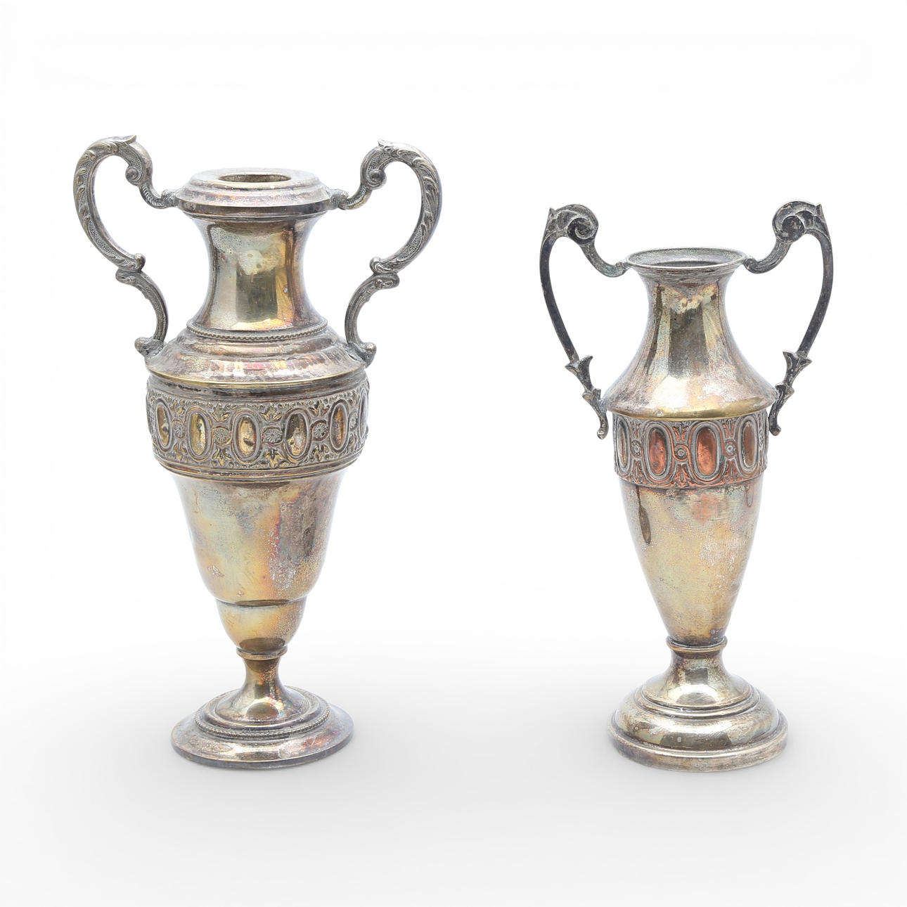 Two silvery metal amphorae.