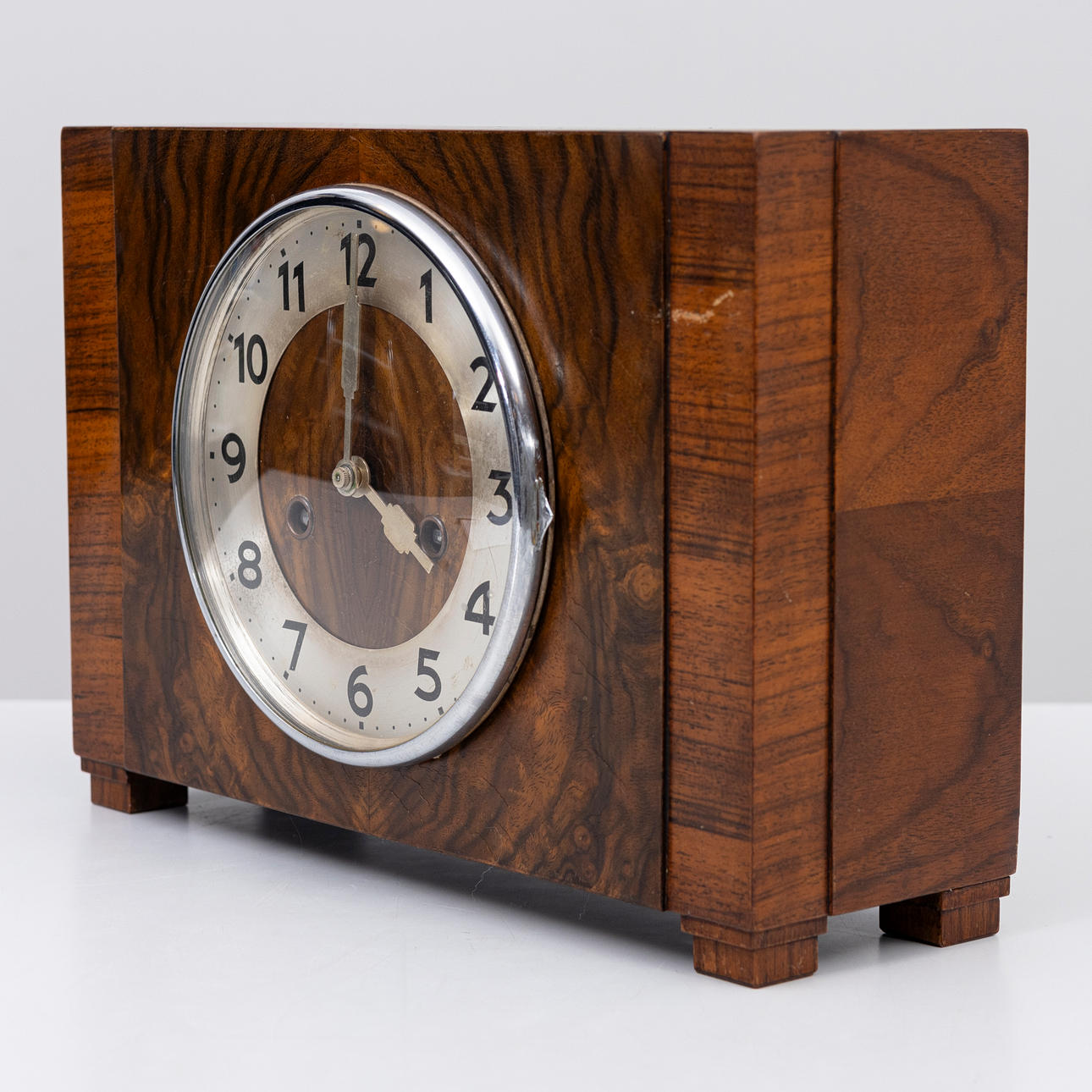 A 1930s Art Deco walnut table clock.