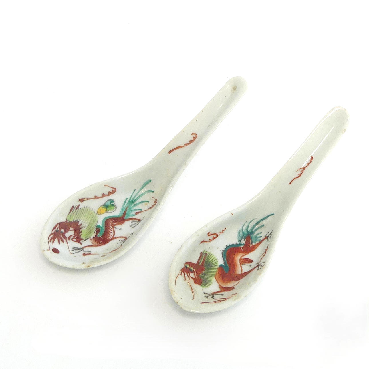 Two porcelain spoons with dragon decor, China.