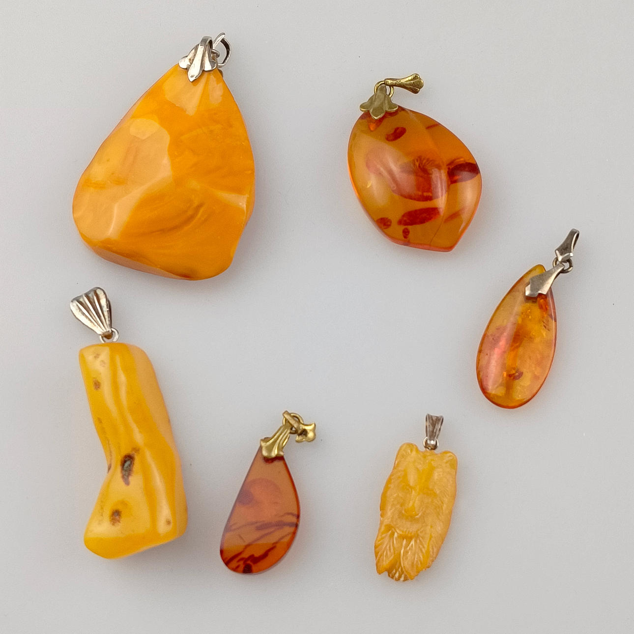 6 AMBER PENDANTS.