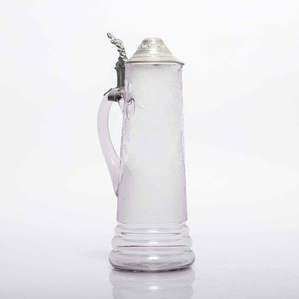 Jug with lid, glass and tin.