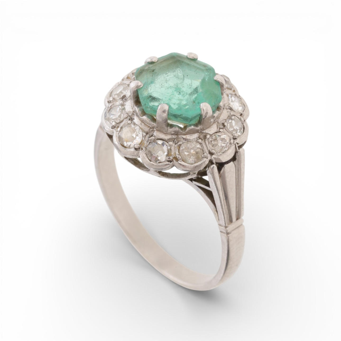 Emerald and diamonds rosette ring, mid 20th Century.