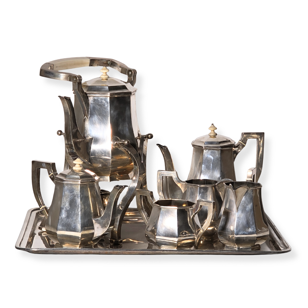 COFFEE AND TEA SET IN PUNCHED SILVER.