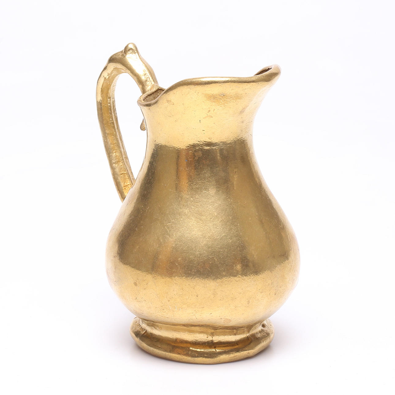 A jug/vase, yellow metal.