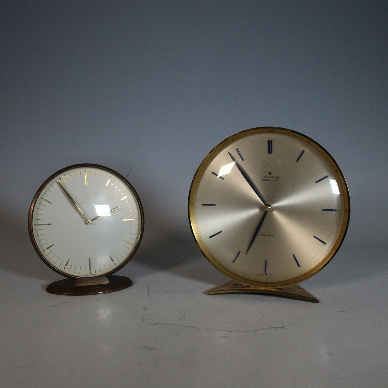 JUNGHANS. Two table clocks including model “ATO-MAT”, brass, quartz, 1970s, Germany.