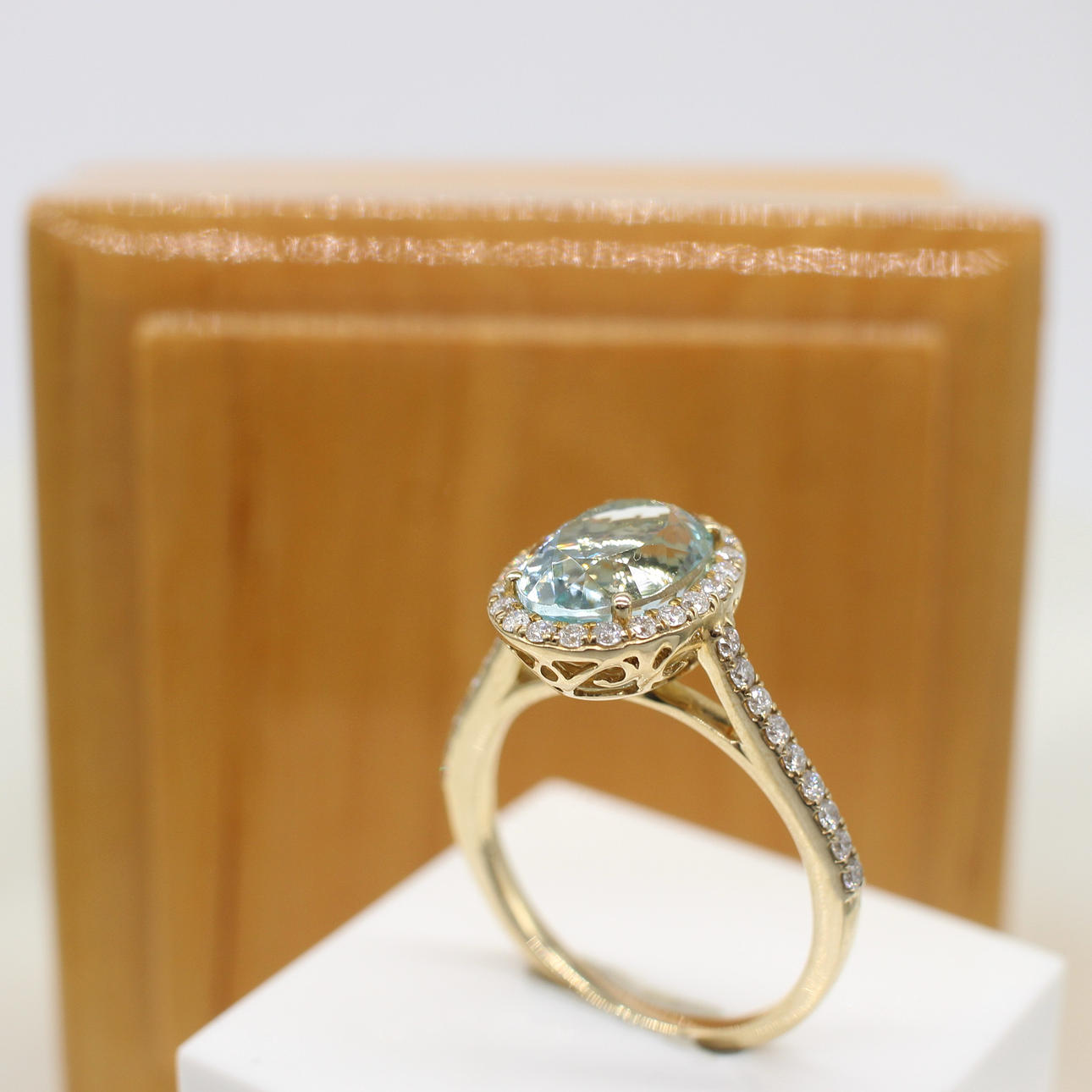 AQUAMARINE & DIAMOND HALO RING.