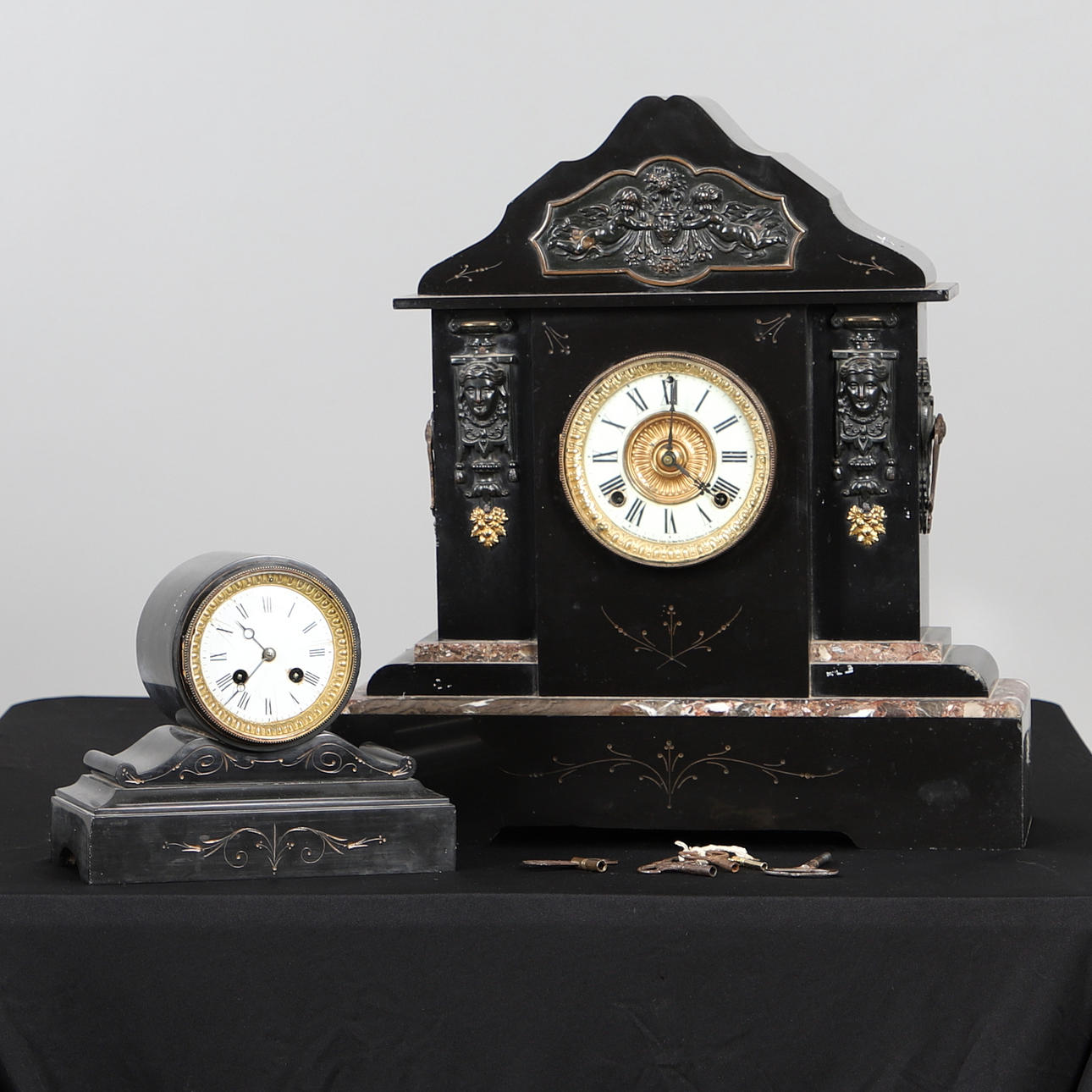 A LARGE VICTORIAN BLACK SLATE MANTEL CLOCK BY THE ANSONIA CLOCK CO
