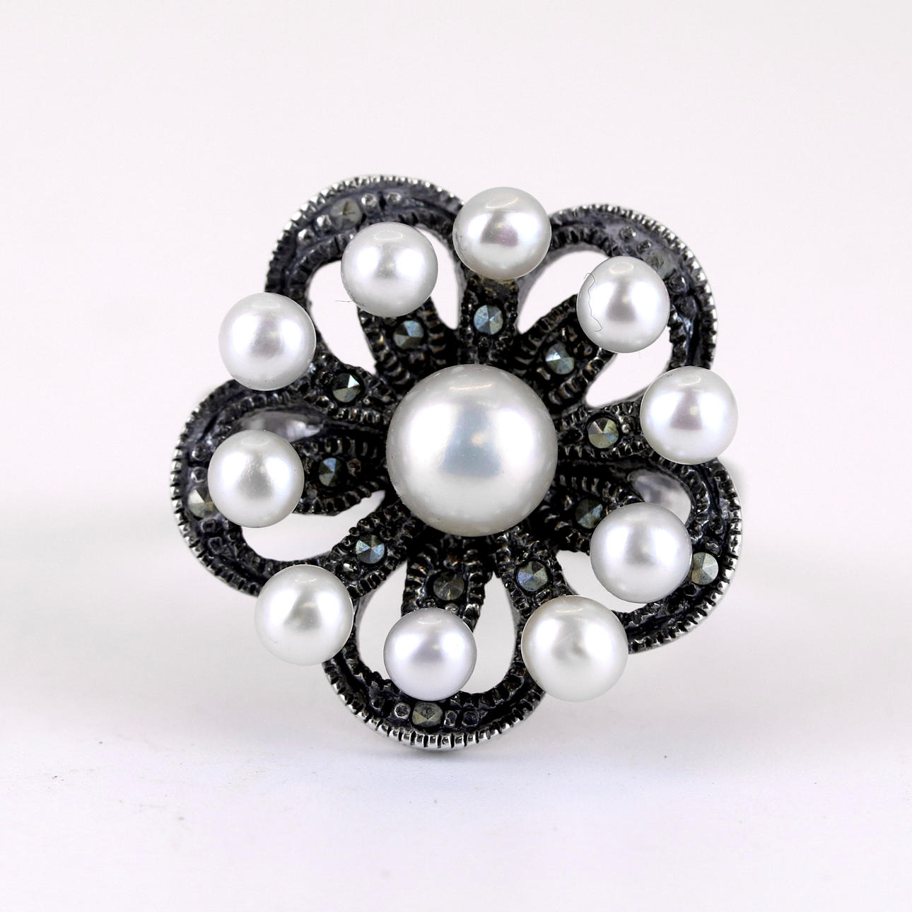 SILVER PEARL AND MARCASITE FLOWER RING.