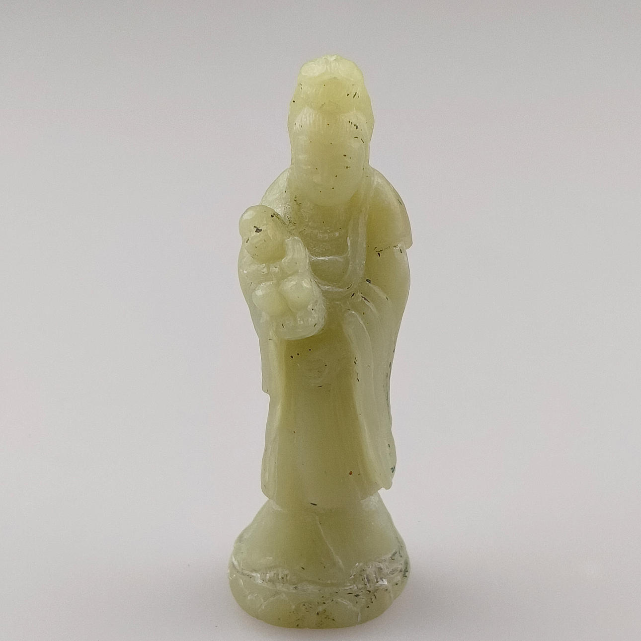 Small stone carving Guanyin with child.