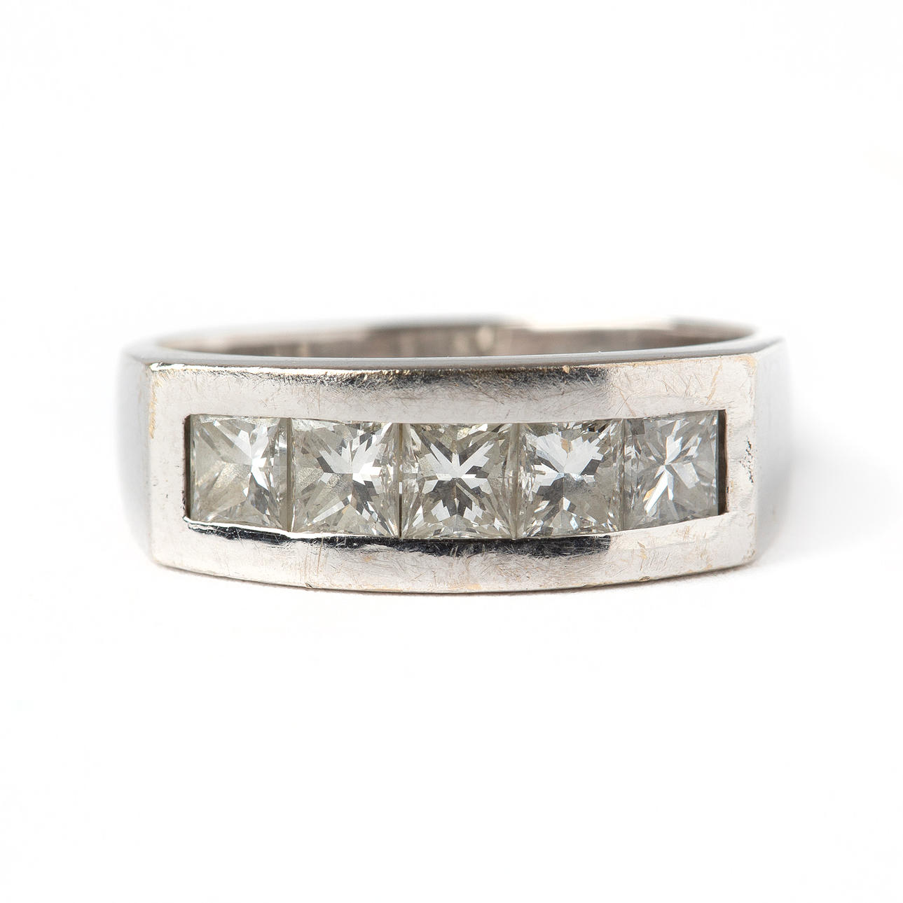 A 14K white gold ring with princess-cut diamonds.