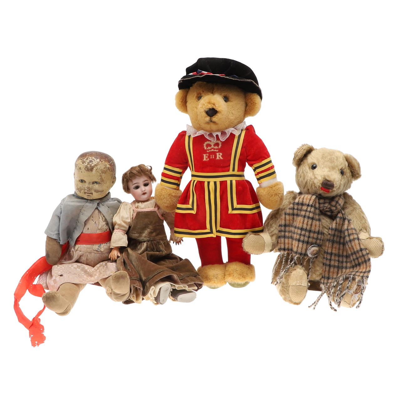 A BISQUE HEADED DOLL, ANOTHER AND TWO TEDDIES.