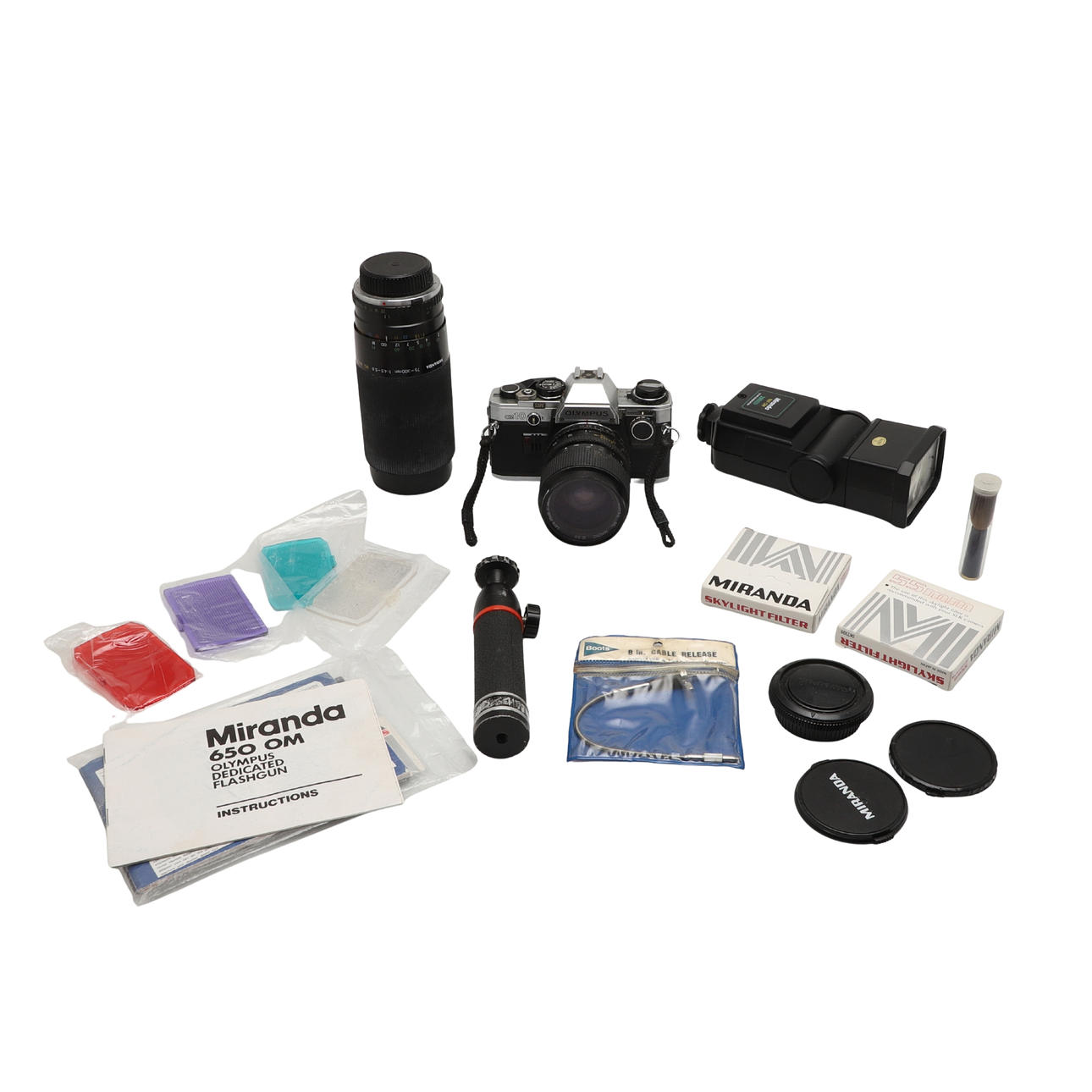 AN OLYMPUS 35mm CAMERA LENS AND ACCESSORIES.