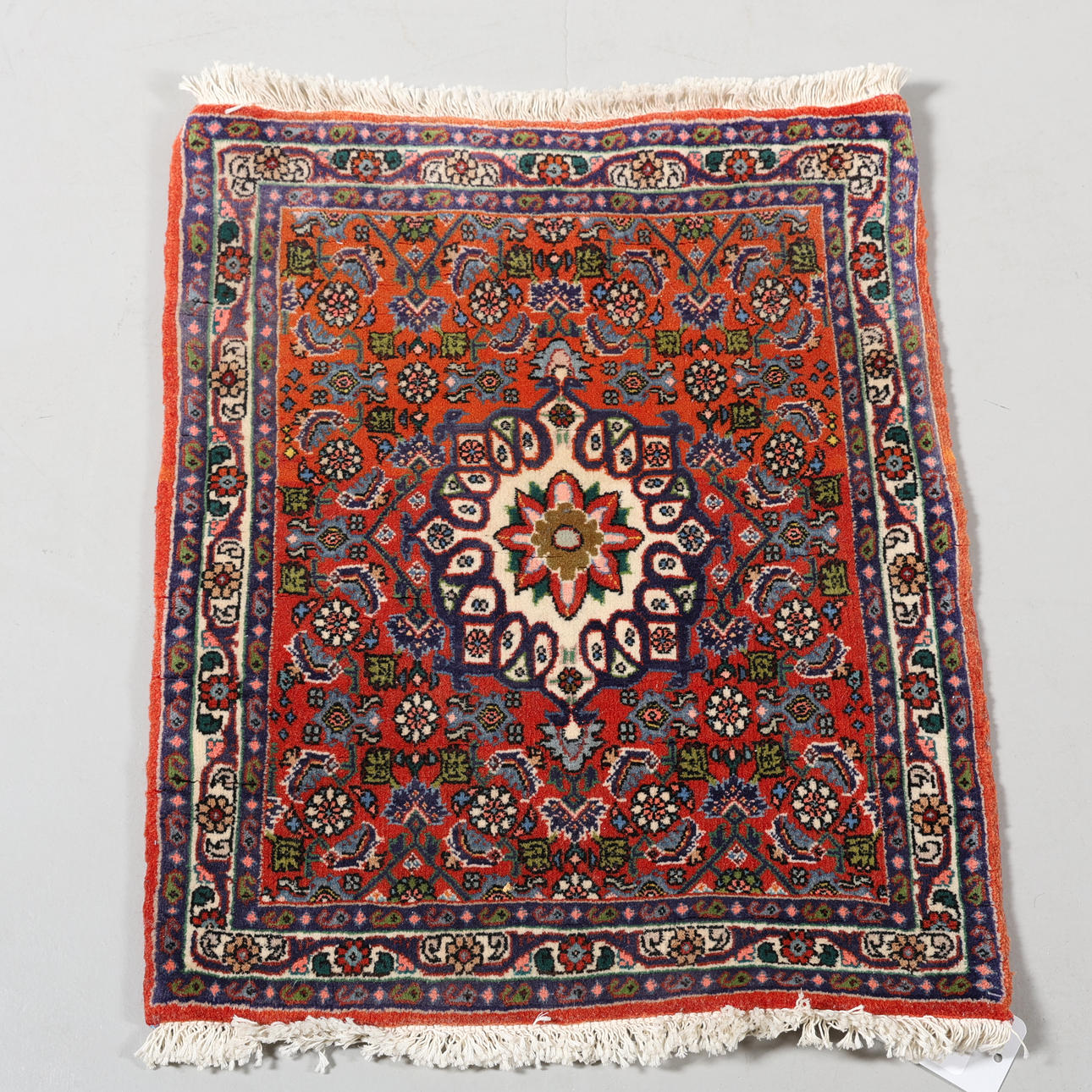 A CARPET, hand-knotted, 63 x 53 cm.