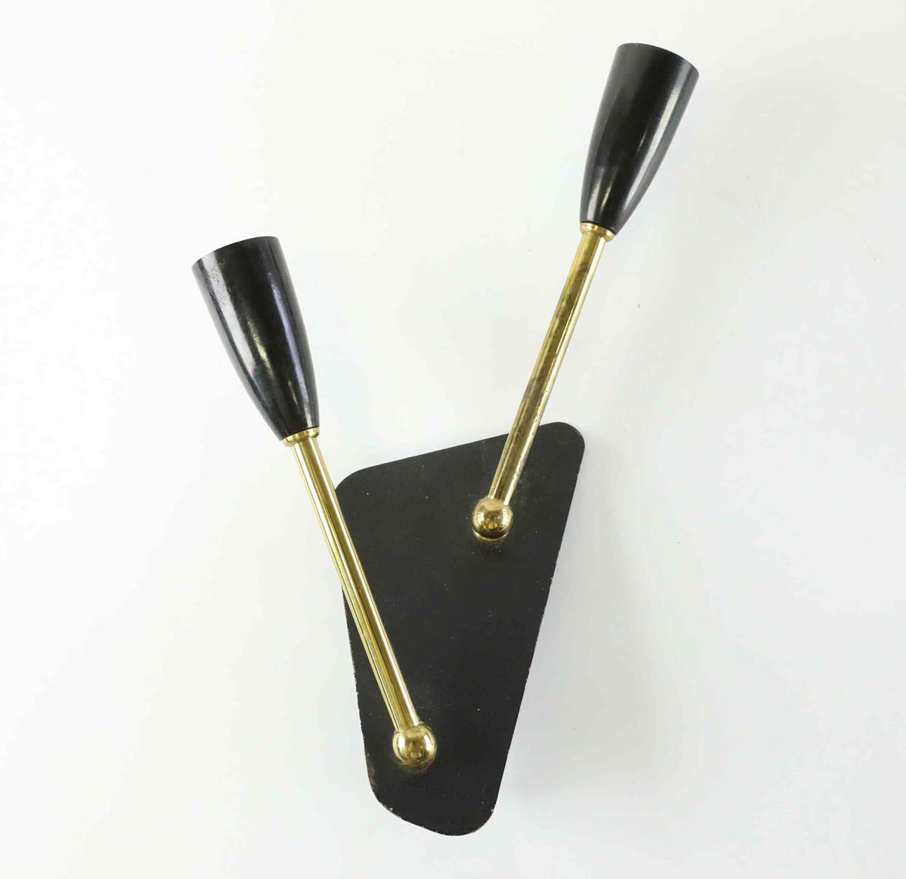 A wall lamp, brass and metal, 1950s.