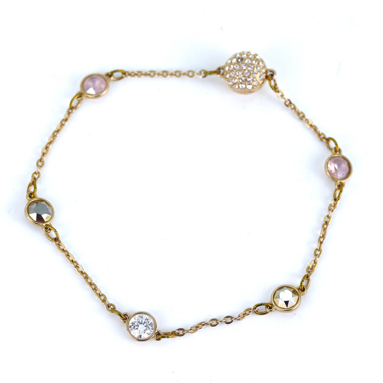 GILT METAL SWAROVSKI BRACELET.
