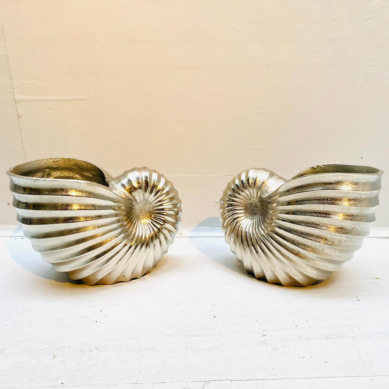 PAIR OF SEA SHELL WINE COOLERS IN POLISHED METAL. Miscellaneous ...
