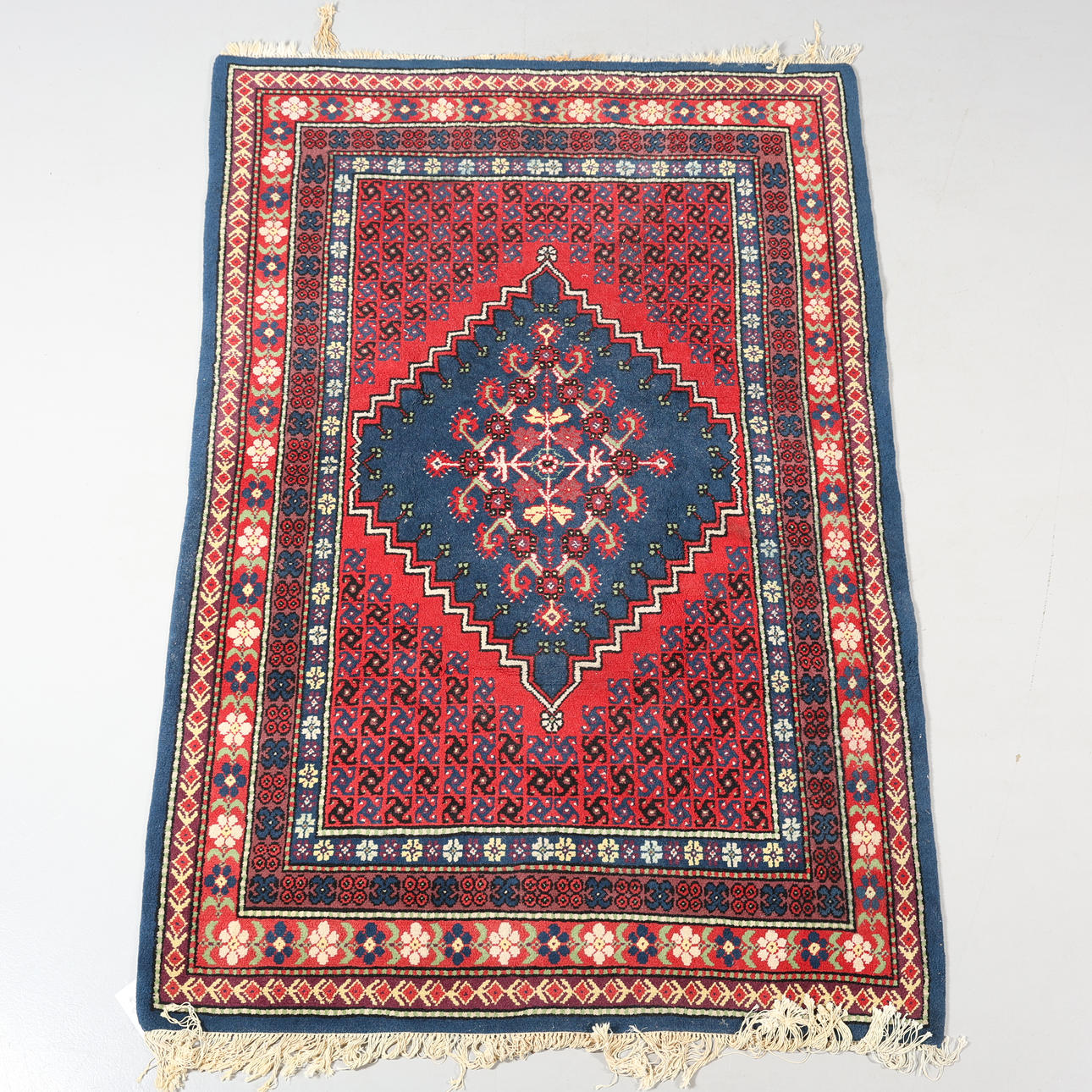 A CARPET, hand-knotted, 236 x 159 cm.